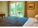 Bedroom view showcases a slider to the deck, and a table with chairs to enjoy the outdoor view at 1423 Alderman Cir, Raleigh, NC 27603