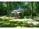 Two-story home with porch and mature trees at 1423 Alderman Cir, Raleigh, NC 27603