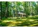 Secluded two-story home with fire pit and mature trees at 1423 Alderman Cir, Raleigh, NC 27603