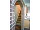 Carpeted staircase leads to upper level adjacent to updated kitchen at 1423 Alderman Cir, Raleigh, NC 27603
