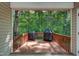 Cozy outdoor porch perfect for grilling and entertaining, with views of the backyard at 1749 Conners Ct, Burlington, NC 27215