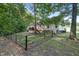 Fenced backyard with a deck and green space, ideal for pets and outdoor activities at 1749 Conners Ct, Burlington, NC 27215