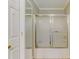 Bathroom with shower featuring glass doors, tile floors, and modern fixtures at 1749 Conners Ct, Burlington, NC 27215