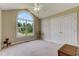 Bright bedroom with large arched window offering a beautiful view and natural light at 1749 Conners Ct, Burlington, NC 27215