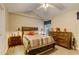 Inviting main bedroom with vaulted ceiling, a wood dresser, and neutral decor at 1749 Conners Ct, Burlington, NC 27215