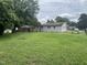 Expansive backyard with lush lawn featuring the house at 1851 S Clearview Dr, Henderson, NC 27536