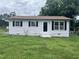 Charming single-story home with light siding, dark shutters and a well-maintained front lawn at 1851 S Clearview Dr, Henderson, NC 27536