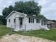 Charming single-story home with light siding, and a well-maintained front lawn and chain link fence at 1851 S Clearview Dr, Henderson, NC 27536