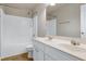 Neutral bathroom with dual sinks, generous vanity storage, a toilet, and shower-tub combo at 201 Masterwood Way, Morrisville, NC 27560