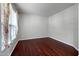 An empty room featuring hardwood flooring and a large window at 201 Masterwood Way, Morrisville, NC 27560
