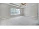 Bedroom with carpet floors and large window at 201 Masterwood Way, Morrisville, NC 27560