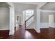 Open foyer featuring dark hardwood flooring, stairway, and decorative columns at 201 Masterwood Way, Morrisville, NC 27560