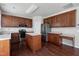 Updated kitchen with stainless steel appliances, an island, and wood cabinets at 201 Masterwood Way, Morrisville, NC 27560