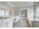 Open-concept bathroom with tile floors and dual vanity sinks with access to the main bedroom at 201 Masterwood Way, Morrisville, NC 27560