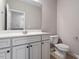 Bright bathroom featuring a white vanity with a marble countertop and neutral wall paint at 2060 Jersey City Pl, Apex, NC 27523