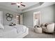 Relaxing bedroom with a tray ceiling, soft carpet, neutral walls and an adjacent bathroom at 2060 Jersey City Pl, Apex, NC 27523