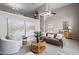 Spacious living room with large windows, neutral colors, and modern furnishings at 2060 Jersey City Pl, Apex, NC 27523