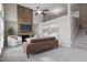 Modern living room with a stone fireplace, large windows, and comfortable seating at 2060 Jersey City Pl, Apex, NC 27523