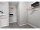 Spacious walk-in closet with ample shelving and neutral carpeting for easy organization at 2060 Jersey City Pl, Apex, NC 27523