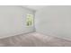 Neutral bedroom with bright window and carpet at 2101 Wimberly Woods Dr, Sanford, NC 27330