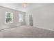 Spacious bedroom boasts plush carpeting, two bright windows, and neutral walls at 2101 Wimberly Woods Dr, Sanford, NC 27330