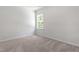 Neutral bedroom with carpet and bright window at 2101 Wimberly Woods Dr, Sanford, NC 27330