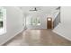 Inviting living room with hardwood floors, a staircase, and a bright window providing natural light at 2101 Wimberly Woods Dr, Sanford, NC 27330