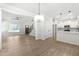 Open-concept living space featuring hardwood floors, a staircase, new kitchen, and a ceiling fan at 2101 Wimberly Woods Dr, Sanford, NC 27330