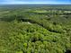 Bird's eye view of property set amid a beautiful forest backdrop at 224 Oakcrest Dr, Wake Forest, NC 27587