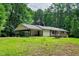 Home exterior featuring a covered carport, and spacious backyard at 224 Oakcrest Dr, Wake Forest, NC 27587