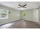 Bright and airy bedroom with updated flooring, a ceiling fan, and great natural light at 224 Oakcrest Dr, Wake Forest, NC 27587