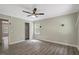 Bedroom showcasing laminate flooring, natural light, a ceiling fan, and neutral wall color at 224 Oakcrest Dr, Wake Forest, NC 27587