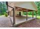 Spacious carport offering covered parking, with a door providing access to the home at 224 Oakcrest Dr, Wake Forest, NC 27587