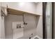 Small utility room with utility hookups, a shelf, and a sliding barn door at 224 Oakcrest Dr, Wake Forest, NC 27587