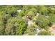 A beautiful aerial view shows a property surrounded by dense trees with a red marker indicating the home's location at 225 Vance St, Chapel Hill, NC 27516