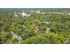 Expansive aerial view of wooded community with the property marked by a red pin at 225 Vance St, Chapel Hill, NC 27516
