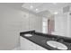 Bathroom showcasing a double sink vanity with a large mirror and modern lighting fixtures at 225 Vance St, Chapel Hill, NC 27516