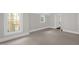 Bedroom with a view, showcasing bright, natural light through the white-trimmed windows at 225 Vance St, Chapel Hill, NC 27516