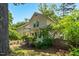 Charming two-story home surrounded by lush landscaping and mature trees, creating a private setting at 225 Vance St, Chapel Hill, NC 27516