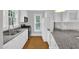 Well-lit kitchen with stainless steel appliances, granite counters, and ample cabinet space at 225 Vance St, Chapel Hill, NC 27516