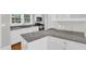 Modern kitchen featuring granite counters, stainless steel appliances, and white cabinetry at 225 Vance St, Chapel Hill, NC 27516