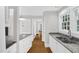 Spacious kitchen featuring granite countertops, stainless steel sink, and ample natural light at 225 Vance St, Chapel Hill, NC 27516