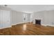 Spacious living room featuring hardwood floors, a fireplace, and neutral wall colors at 225 Vance St, Chapel Hill, NC 27516