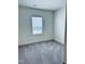 This bedroom is bright and airy with neutral colored walls and carpet at 23 Rolling Banks Dr, Louisburg, NC 27549