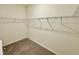 A walk-in closet features plenty of shelving for storage at 23 Rolling Banks Dr, Louisburg, NC 27549