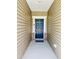 A modern front door welcomes visitors with style and curb appeal at 23 Rolling Banks Dr, Louisburg, NC 27549