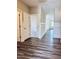 Spacious hallway with elegant wainscoting and modern flooring at 23 Rolling Banks Dr, Louisburg, NC 27549