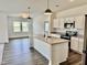 Open-concept kitchen featuring a large island, stainless steel appliances, and modern finishes at 23 Rolling Banks Dr, Louisburg, NC 27549