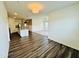 Bright living room area flows into the open kitchen with its inviting hardwood floors and modern design at 23 Rolling Banks Dr, Louisburg, NC 27549