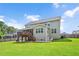 Spacious backyard featuring a deck, walkout basement, and well-maintained lawn, ideal for outdoor enjoyment at 232 Randleman Ct, Holly Springs, NC 27540